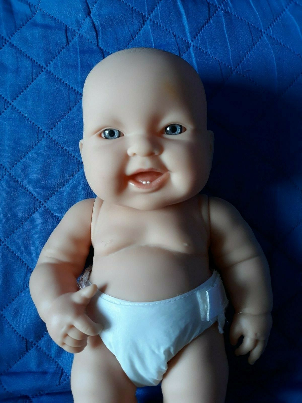 BERENGUER 13 INCH LIFELIKE  DOLL VINYL OPEN BLUE EYES SMILING MOVEABLE ARMS,
